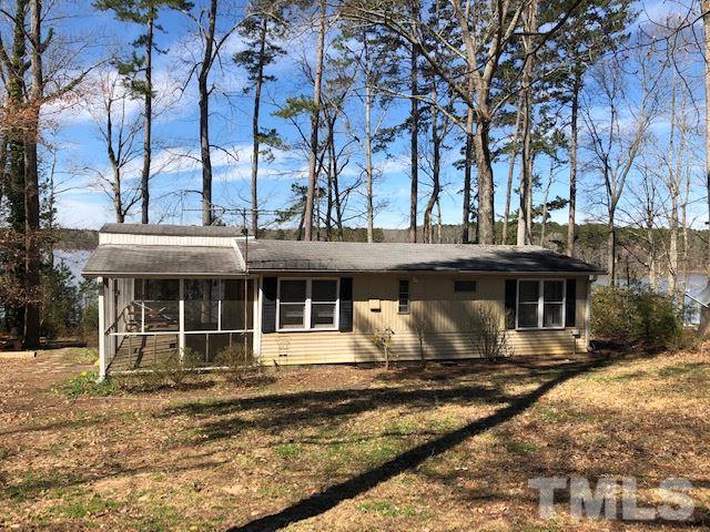 291 Kerr Lake Road Henderson, NC 27537 - Photo 1 of 15 a front view of a house with a yard