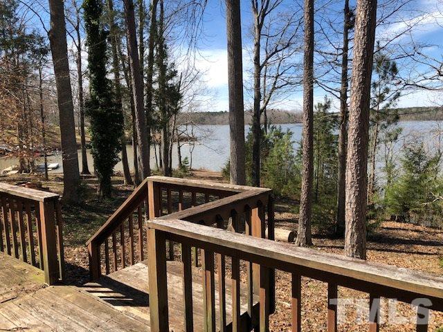 291 Kerr Lake Road Henderson, NC 27537 - Photo 3 of 15 a view of a balcony with trees