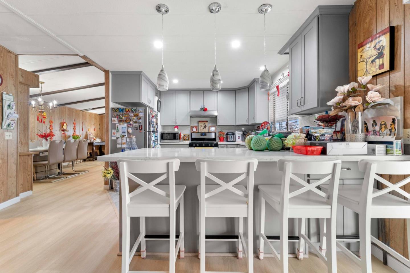 1872 Quimby Road, Unit 1872 San Jose, CA 95122 - Photo 16 of 36 a kitchen with a dining table chairs and white cabinets