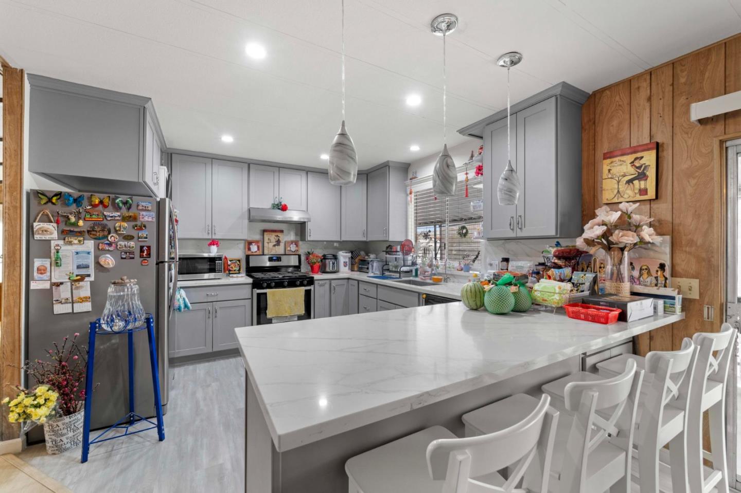 1872 Quimby Road, Unit 1872 San Jose, CA 95122 - Photo 17 of 36 a kitchen with a sink a stove and chairs