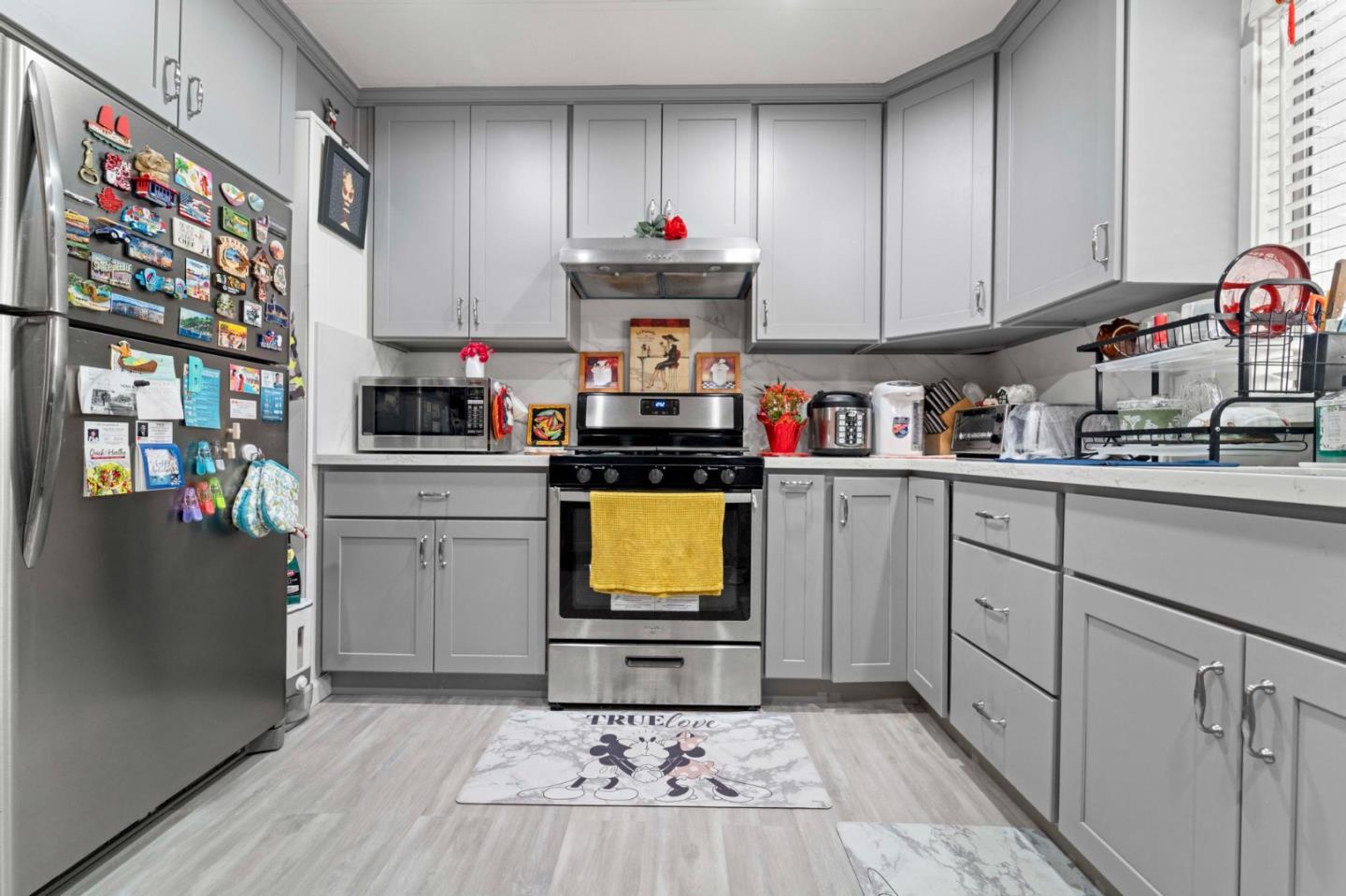 1872 Quimby Road, Unit 1872 San Jose, CA 95122 - Photo 18 of 36 a kitchen with stainless steel appliances a stove top oven a sink and cabinets