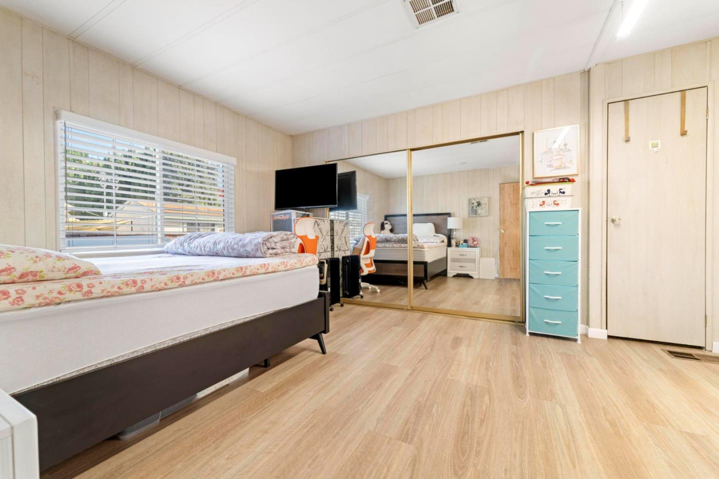 1872 Quimby Road, Unit 1872 San Jose, CA 95122 - Photo 20 of 36 a bedroom with a bed and a flat tv screen on dresser