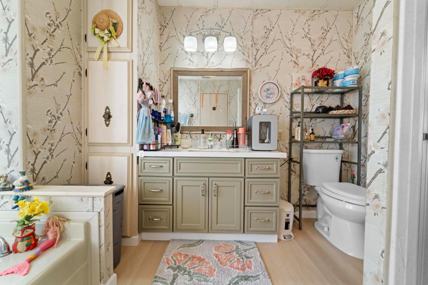 1872 Quimby Road, Unit 1872 San Jose, CA 95122 - Photo 29 of 36 a bathroom with a sink mirror vanity and toilet