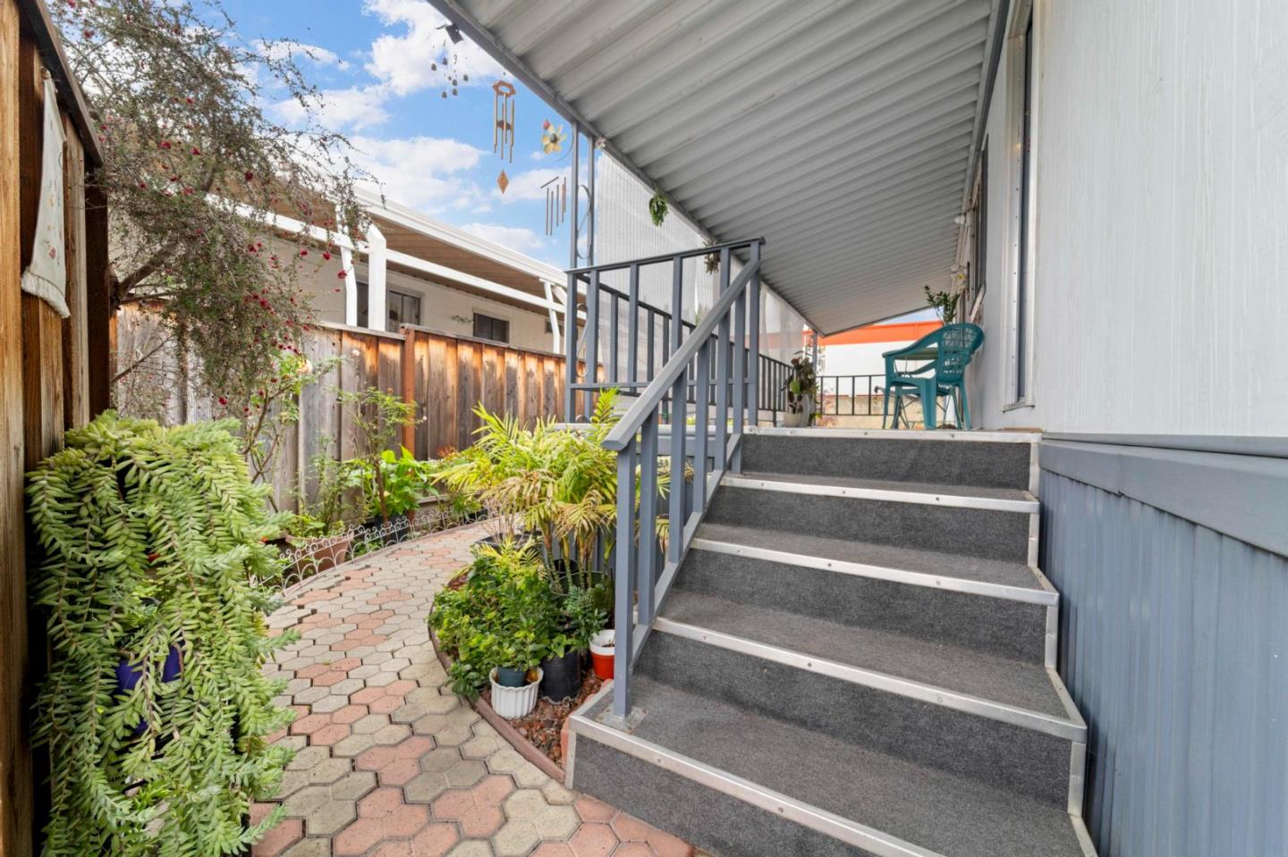 1872 Quimby Road, Unit 1872 San Jose, CA 95122 - Photo 3 of 36 a view of entryway with flower pots