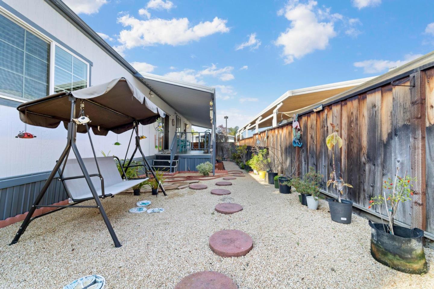 1872 Quimby Road, Unit 1872 San Jose, CA 95122 - Photo 32 of 36 a backyard of a house with table and chairs