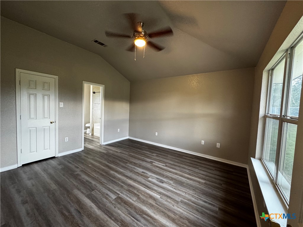 397 County Road 3367 Kempner, TX 76539 - Photo 18 of 47 a view of an empty room with wooden floor and a window