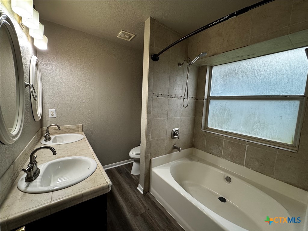 397 County Road 3367 Kempner, TX 76539 - Photo 24 of 47 a bathroom with a sink a toilet and bathtub