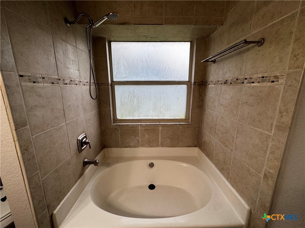 397 County Road 3367 Kempner, TX 76539 - Photo 26 of 47 a bathroom with a sink and a shower