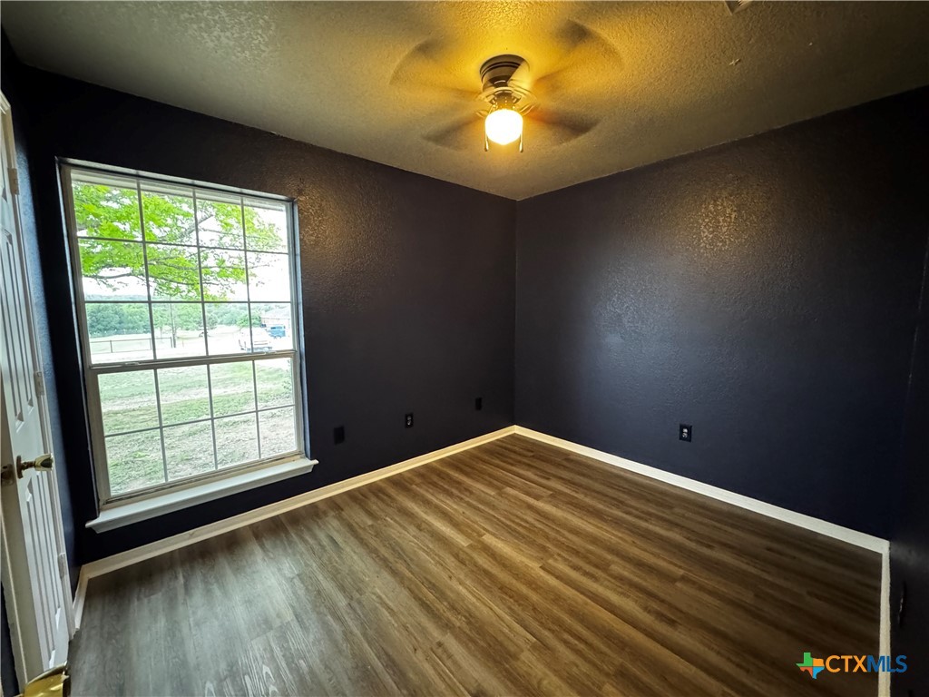 397 County Road 3367 Kempner, TX 76539 - Photo 32 of 47 wooden floor in an empty room with a window