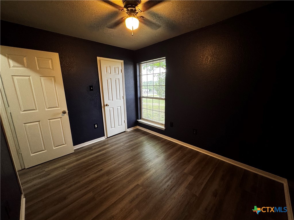 397 County Road 3367 Kempner, TX 76539 - Photo 33 of 47 a view of an empty room with wooden floor and a window