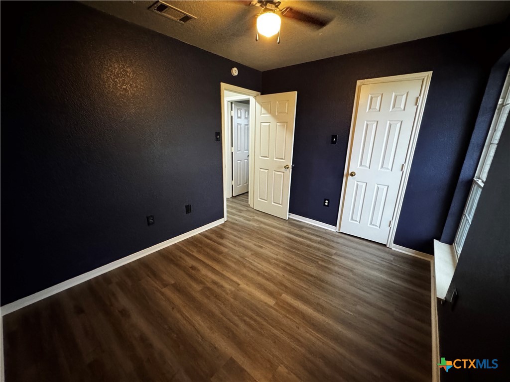 397 County Road 3367 Kempner, TX 76539 - Photo 34 of 47 a view of an empty room with window and wooden floor