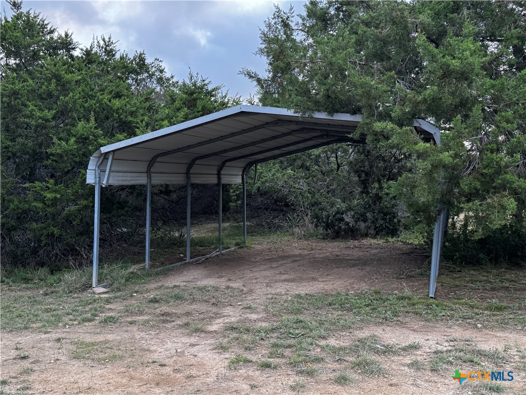 397 County Road 3367 Kempner, TX 76539 - Photo 39 of 47 a backyard of a house with lots of trees