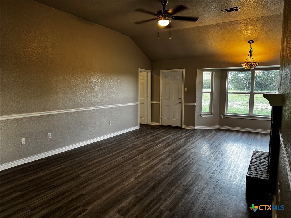 397 County Road 3367 Kempner, TX 76539 - Photo 6 of 47 an empty room with wooden floor and windows