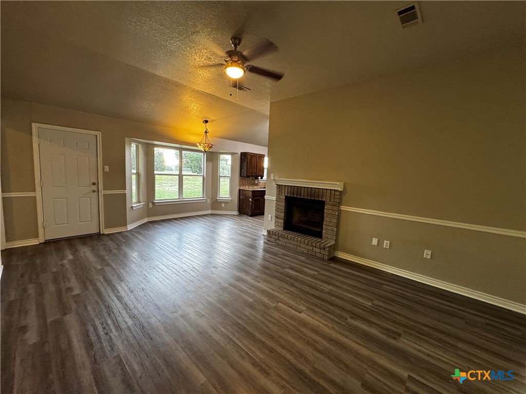 397 County Road 3367 Kempner, TX 76539 - Photo 7 of 47 wooden floor in an empty room with a window