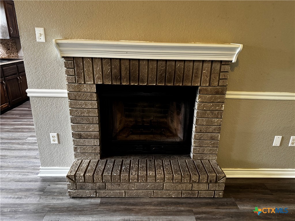 397 County Road 3367 Kempner, TX 76539 - Photo 10 of 47 a view of fireplace and wooden floor