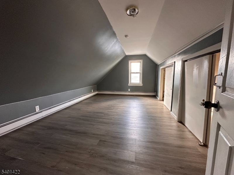 748 Trumbull Street, Unit 2 Elizabeth, NJ 07201 - Photo 10 of 13 a view of a room with wooden floor and window