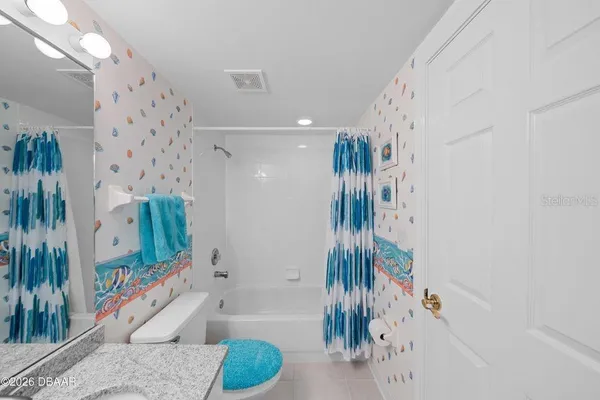 a bathroom with a tub and a shower
