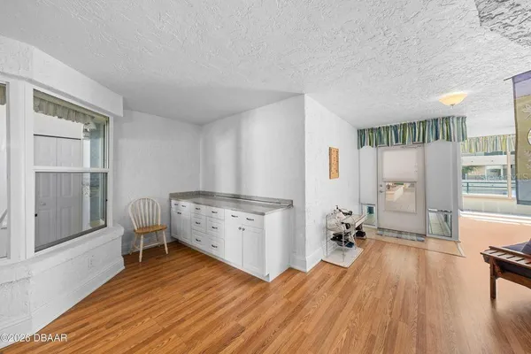 a room with furniture and a wooden floor