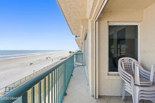 a view of a balcony with wooden floor