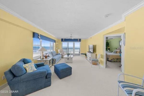 a living room with furniture and a large window