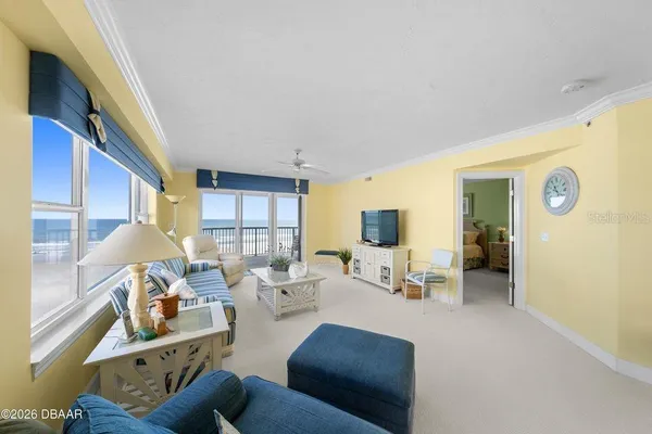 a living room with furniture and a large window