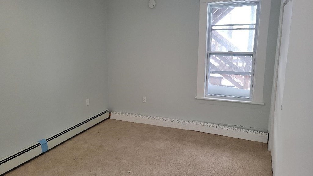 222 Webster Avenue Chelsea, MA 02150 - Photo 12 of 13 an empty room with a window