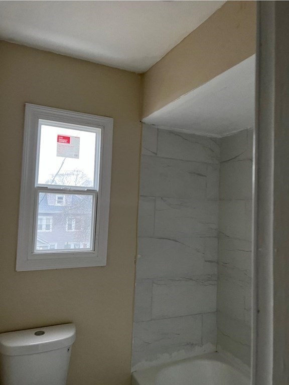 222 Webster Avenue Chelsea, MA 02150 - Photo 13 of 13 a bathroom with a toilet and a shower
