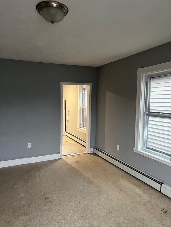 222 Webster Avenue Chelsea, MA 02150 - Photo 4 of 13 an empty room with a window