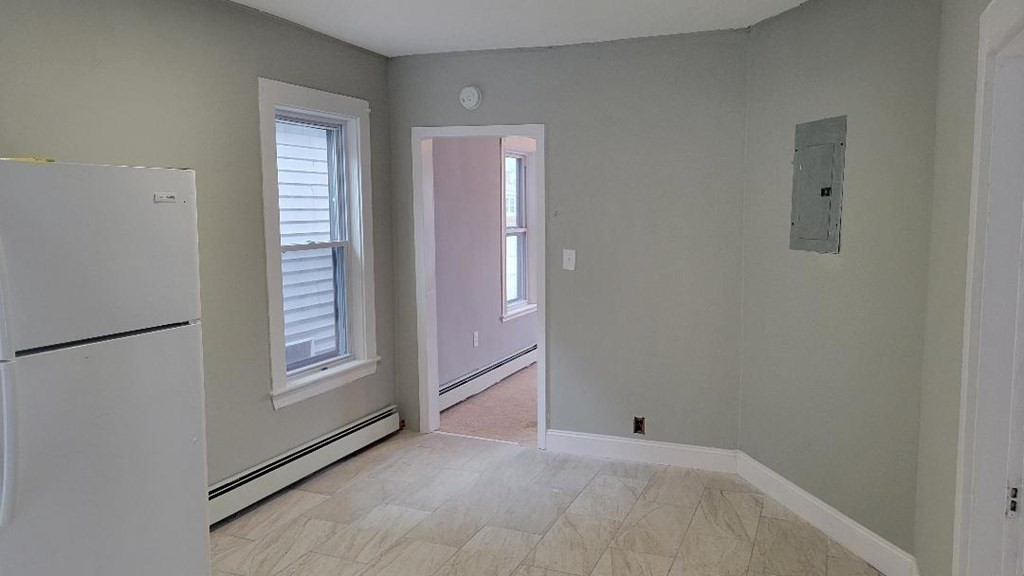 222 Webster Avenue Chelsea, MA 02150 - Photo 10 of 13 an empty room with windows
