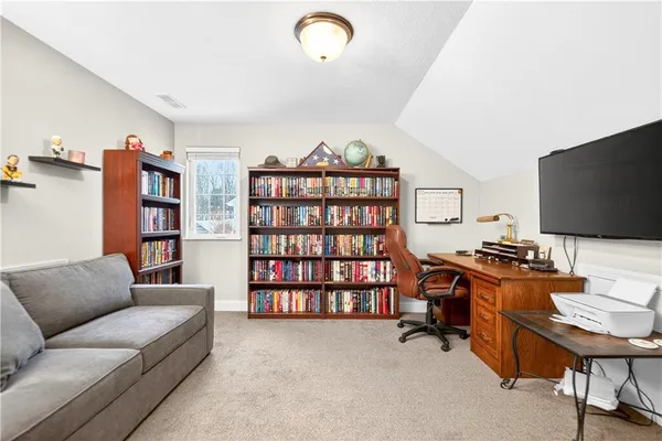 a livingroom with a large window and a couch