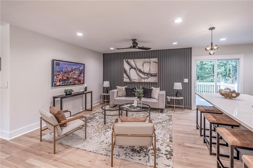 605 Blake Avenue Southeast Atlanta, GA 30316 - Photo 11 of 25 a living room with fireplace furniture and a large window