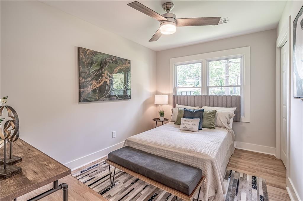 605 Blake Avenue Southeast Atlanta, GA 30316 - Photo 16 of 25 a bedroom with a bed and a chandelier