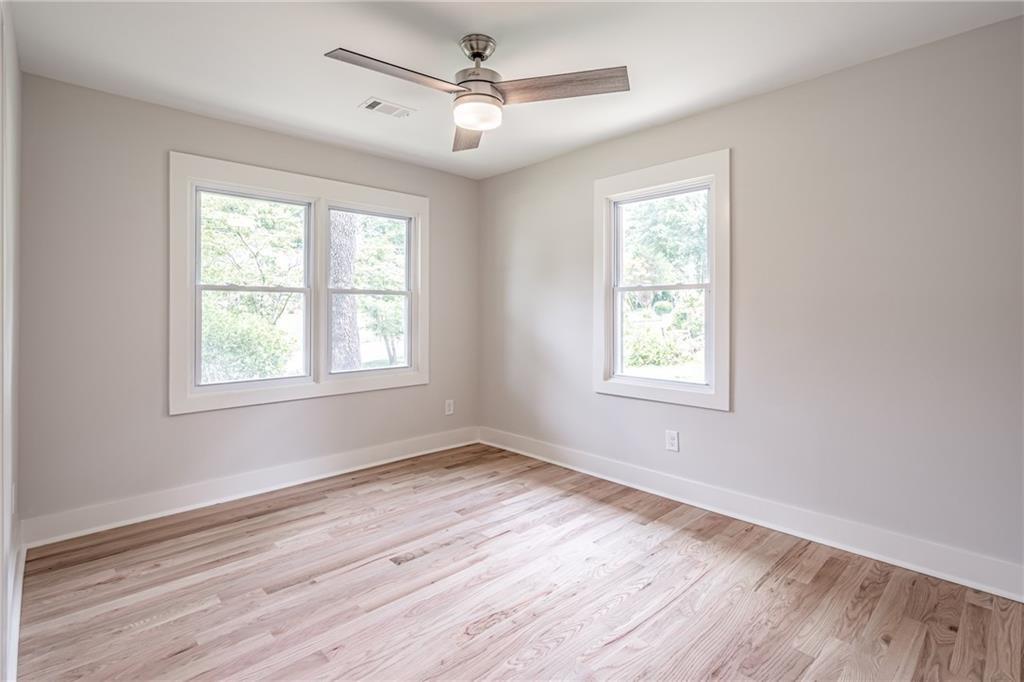 605 Blake Avenue Southeast Atlanta, GA 30316 - Photo 17 of 25 a view of empty room with wooden floor and fan