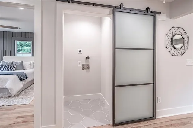 a bathroom with a shower and a mirror