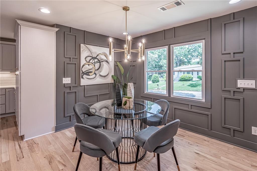 605 Blake Avenue Southeast Atlanta, GA 30316 - Photo 3 of 25 a view of a dining room with furniture window and wooden floor