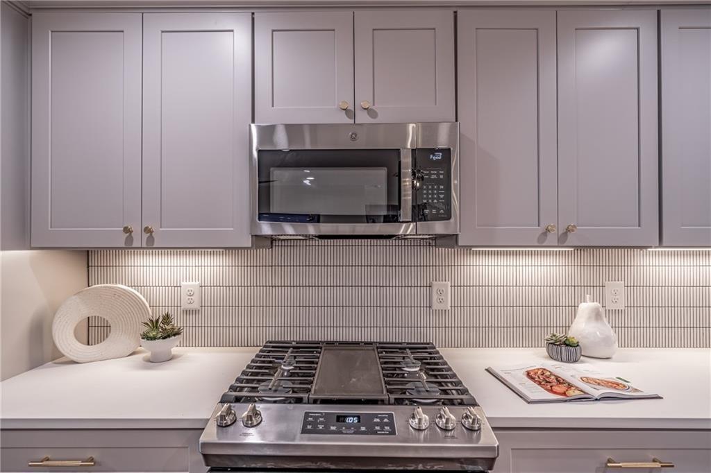 605 Blake Avenue Southeast Atlanta, GA 30316 - Photo 7 of 25 a kitchen with a stove and cabinets