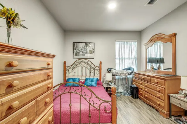 a bed room with a bed and a large window