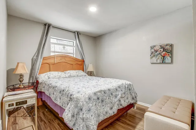 a bedroom with a bed and a dresser