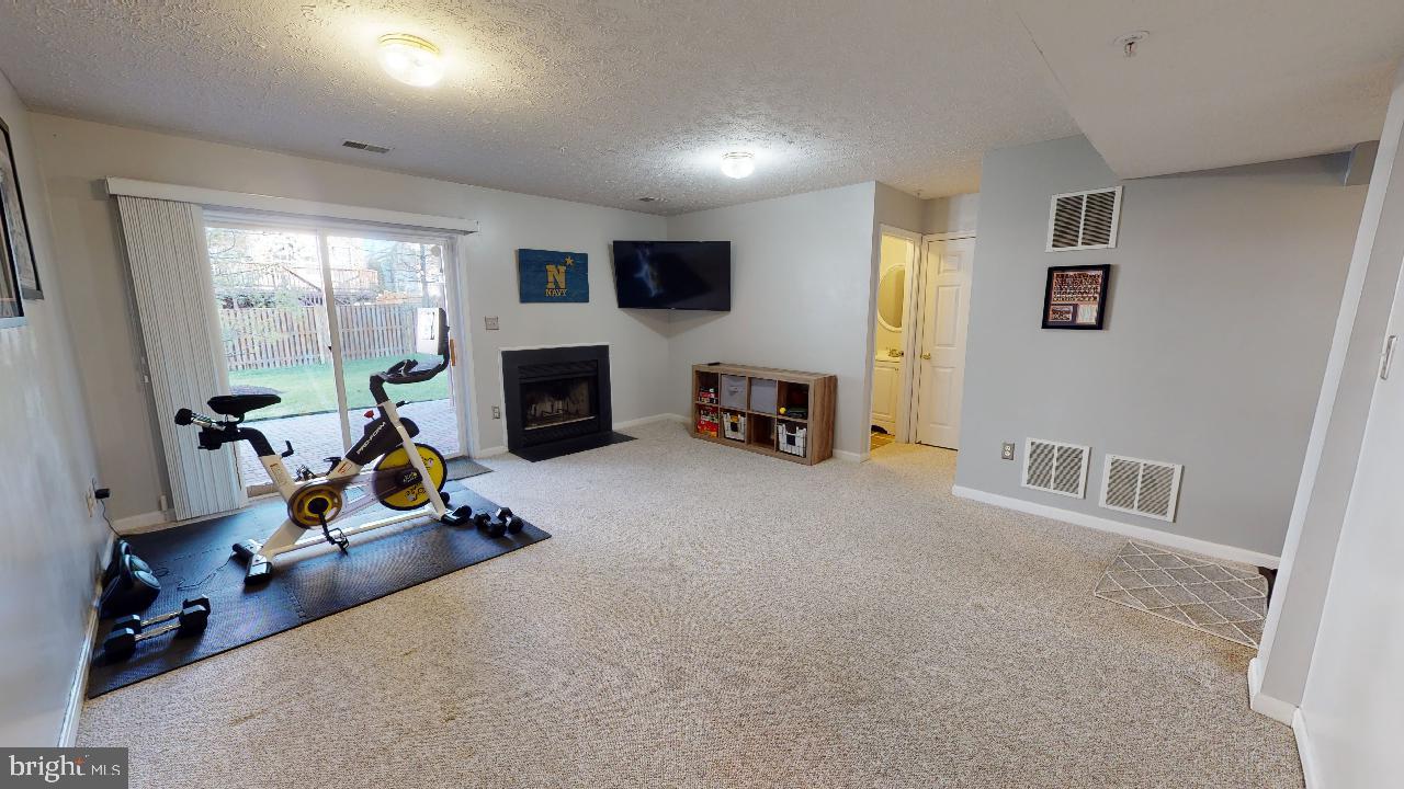 8709 Riverscape Court Odenton, MD 21113 - Photo 8 of 65 Family room with sliding glass door to patio