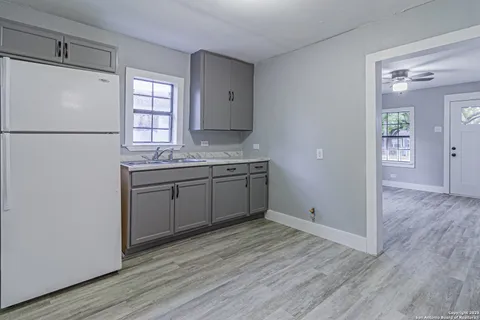 a view of a kitchen from the hallway