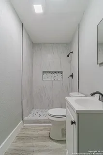 an empty room with a ceiling fan