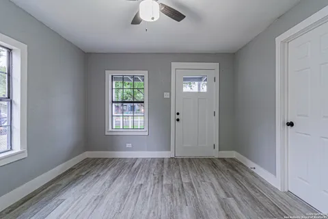 a kitchen with a refrigerator sink stove and cabinets