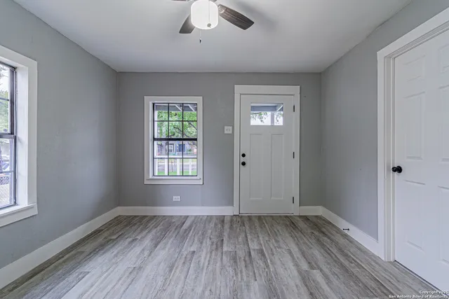a kitchen with a refrigerator sink stove and cabinets