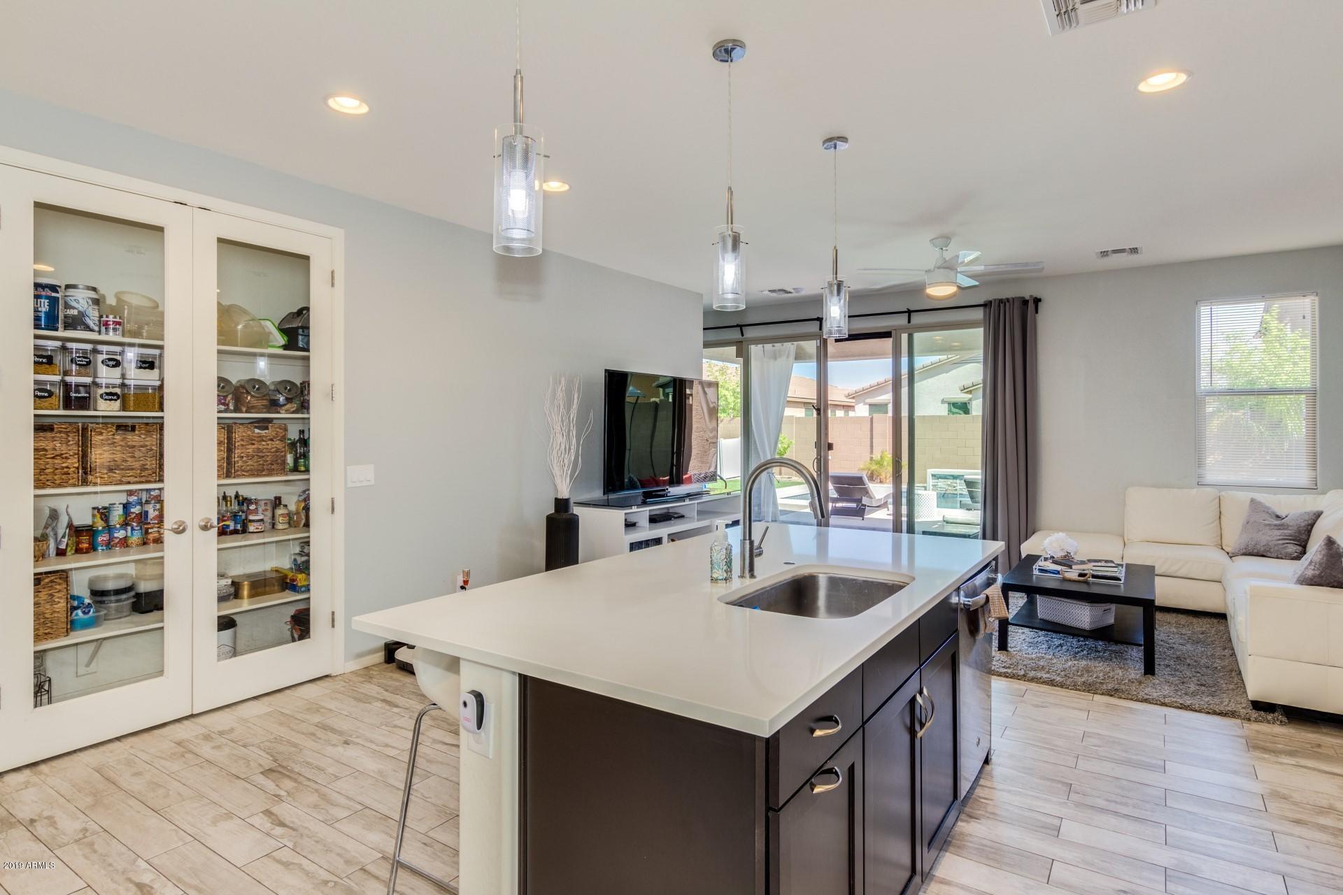 7726 West Shumway Farm Road Laveen, AZ 85339 - Photo 12 of 27 a large kitchen with a counter space