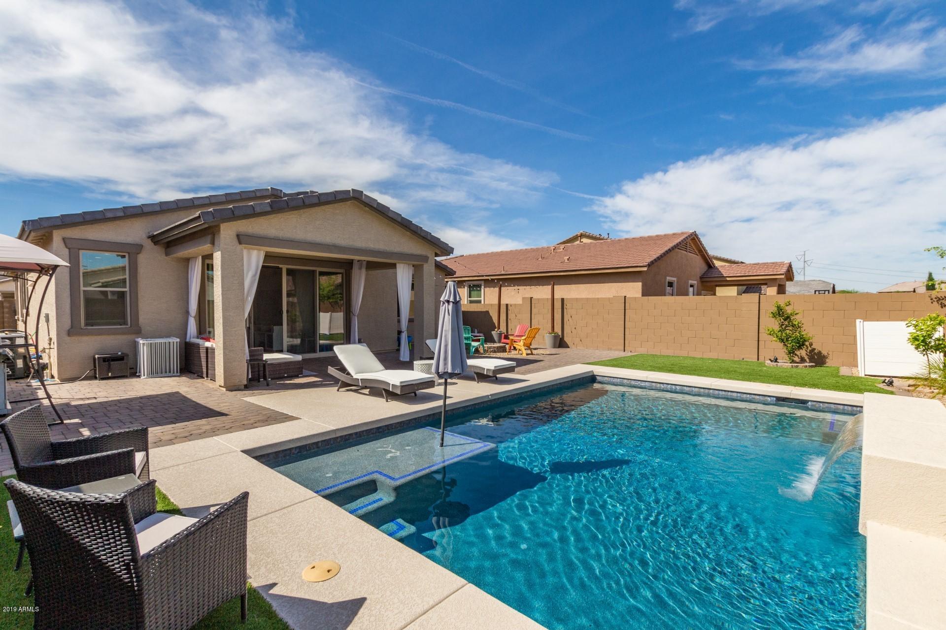 7726 West Shumway Farm Road Laveen, AZ 85339 - Photo 23 of 27 a view of a house with pool table and chairs