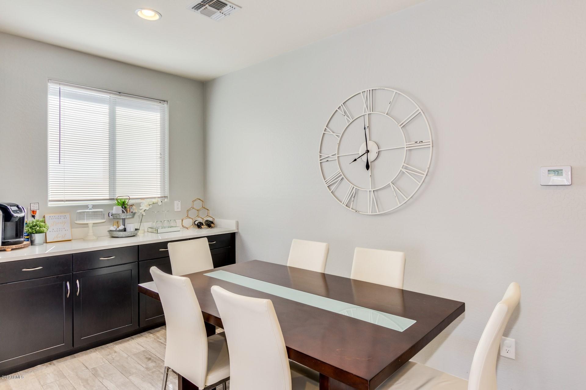 7726 West Shumway Farm Road Laveen, AZ 85339 - Photo 9 of 27 a view of a dining room with furniture