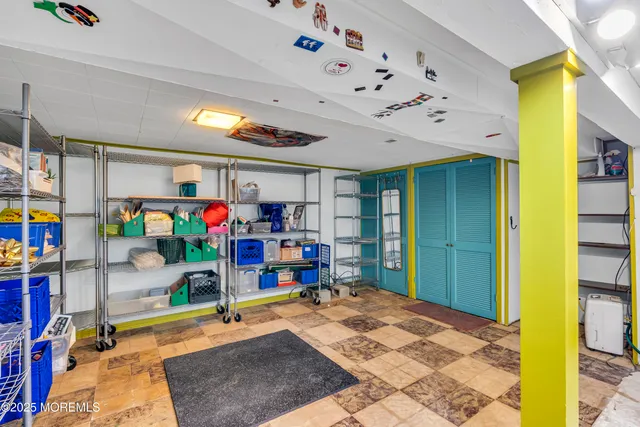 a bedroom with furniture and a flat screen tv