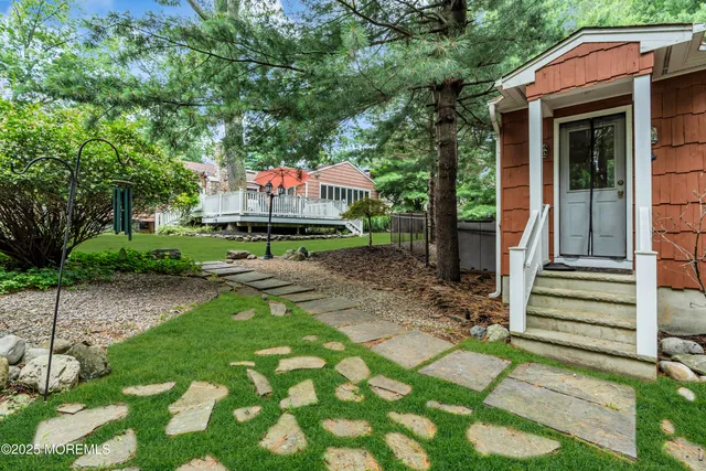 a sign board with yard in front of it