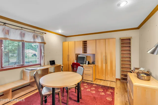 a living room with furniture a table and a large window