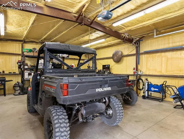 a view of a storage room with a table and chairs